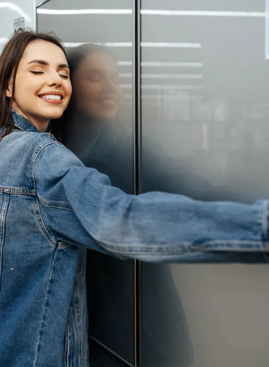 young-happy-woman-leaning-her-new-refrigerator-mall feepik
